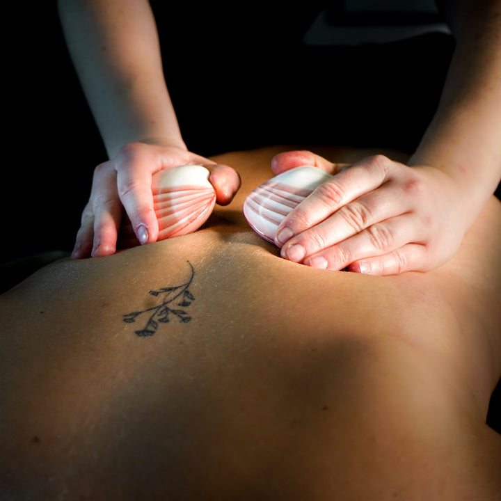 Massage aux coquillages chauds